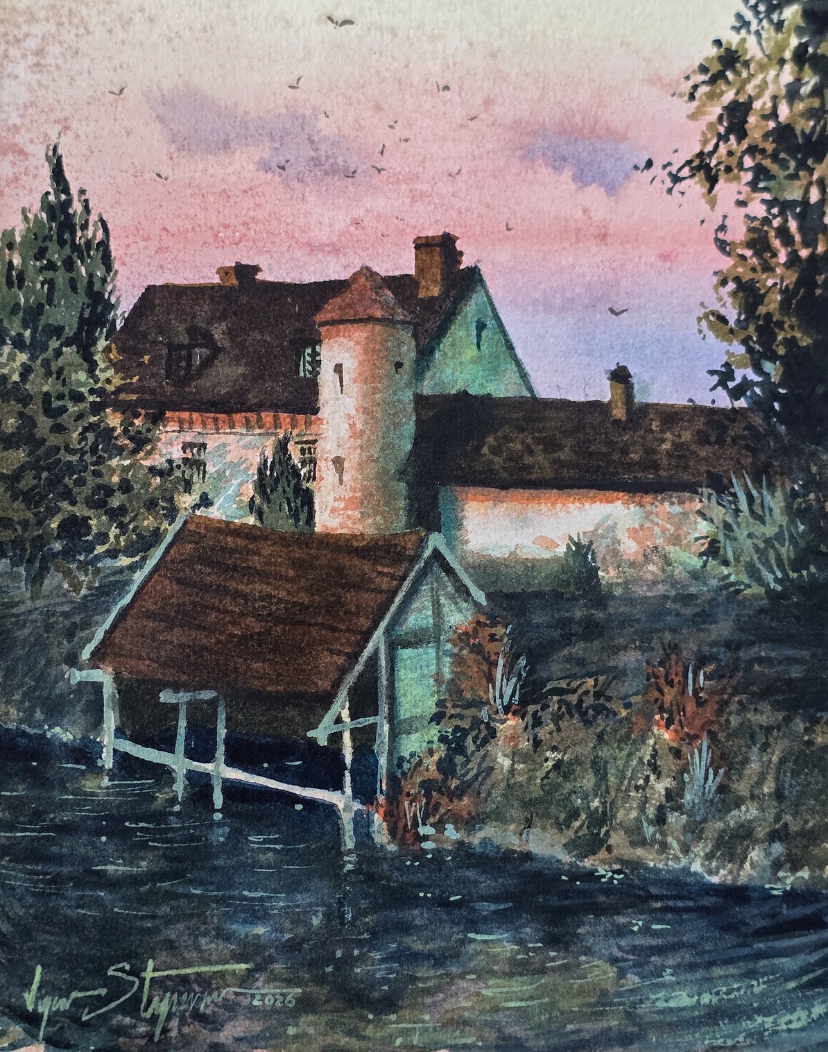 Casas y tejados de Marnay-sur-Seine bajo un cielo rosado